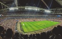 crowd watching football game inside stadium