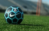 black, blue, and white Soccer ball on grass field